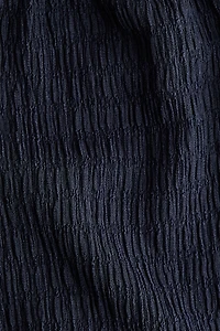 Pantalon large à effet froissé