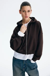 Veste courte à fermeture éclair avec capuche