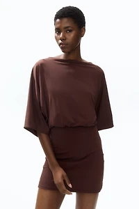 Cape-Sleeved Low-Back Dress
