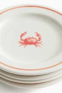 Lot de 4 petites assiettes en porcelaine