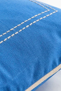 Housse de coussin avec motif brodé