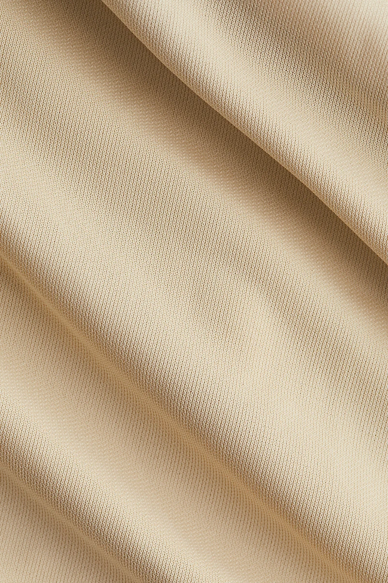 Haut asymétrique à effet drapé