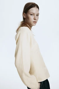 Haut en tricot à encolure V