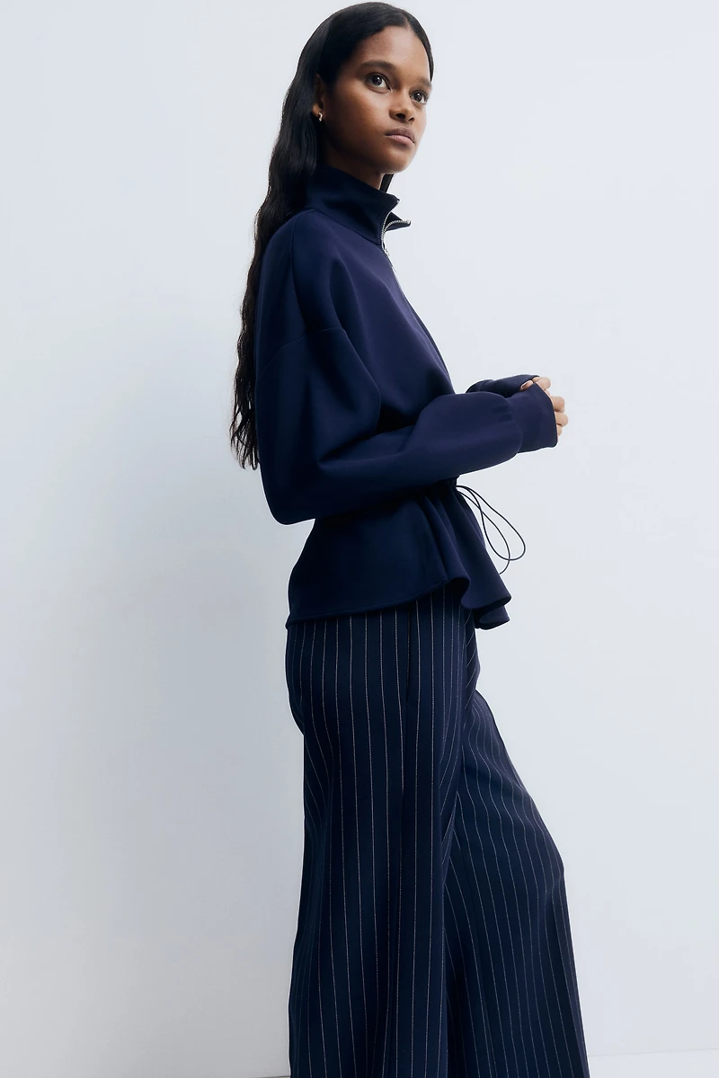 Chandail péplum à fermeture éclair