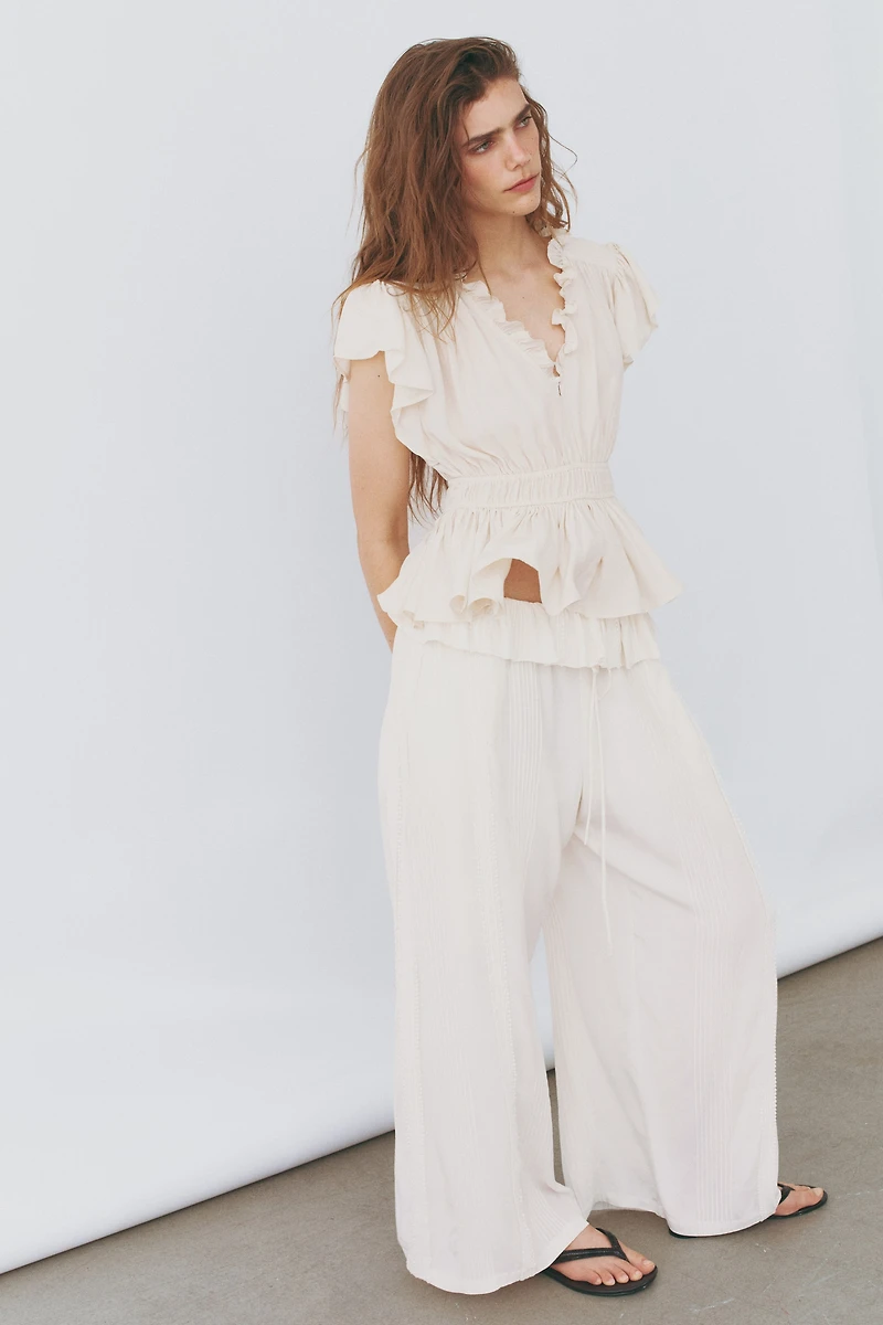 Flutter-Sleeved Peplum Blouse