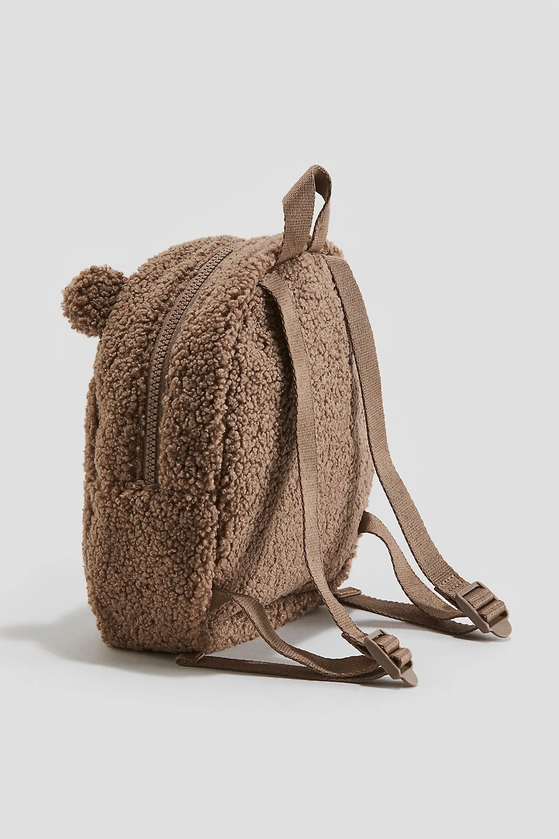 Sac à dos duveteux avec appliqués
