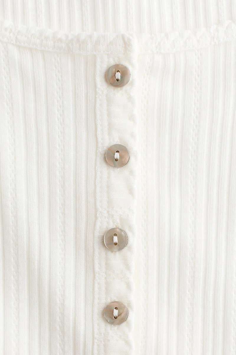 Haut en tricot pointelle