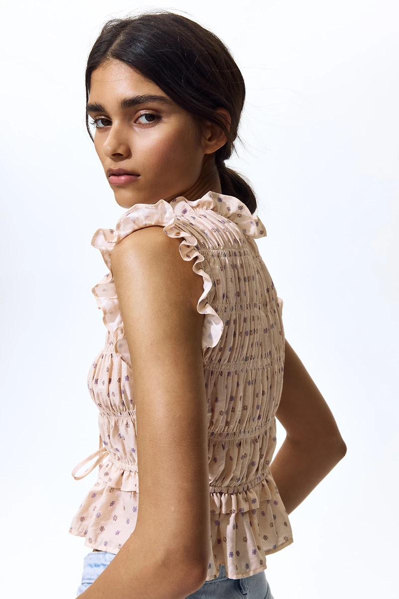 Blouse sans manches en nid d'abeille