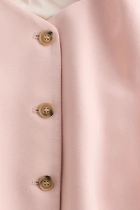 Gilet sans manches avec basque