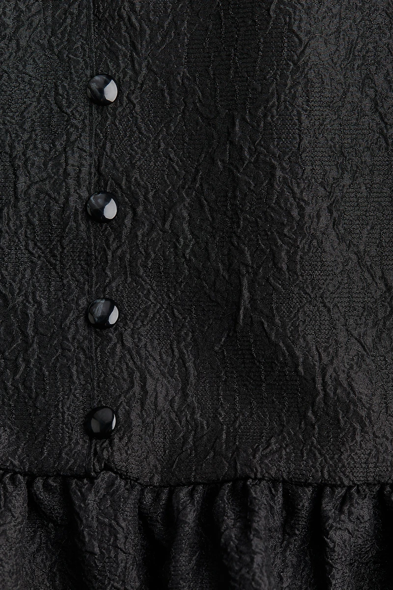 Blouse péplum en brocart