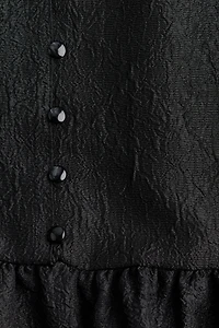 Blouse péplum en brocart
