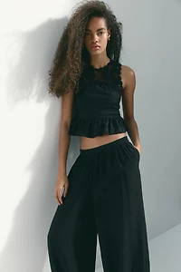 Haut texturé avec partie d’aspect crochet