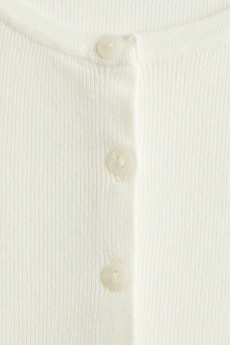 Gilet à manches courtes en fin tricot