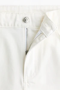 Raw-edge denim shorts