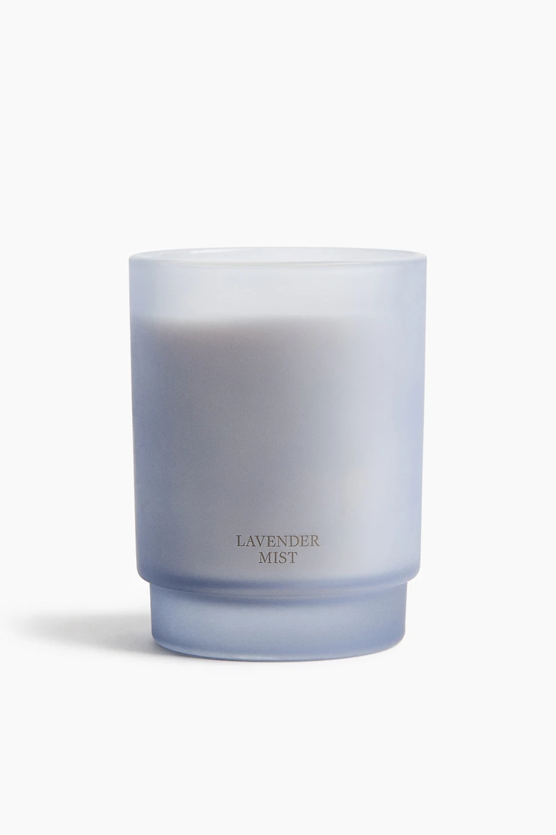 Bougie parfumée dans un pot en verre dépoli