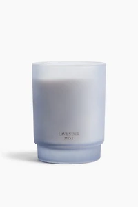 Bougie parfumée dans un pot en verre dépoli