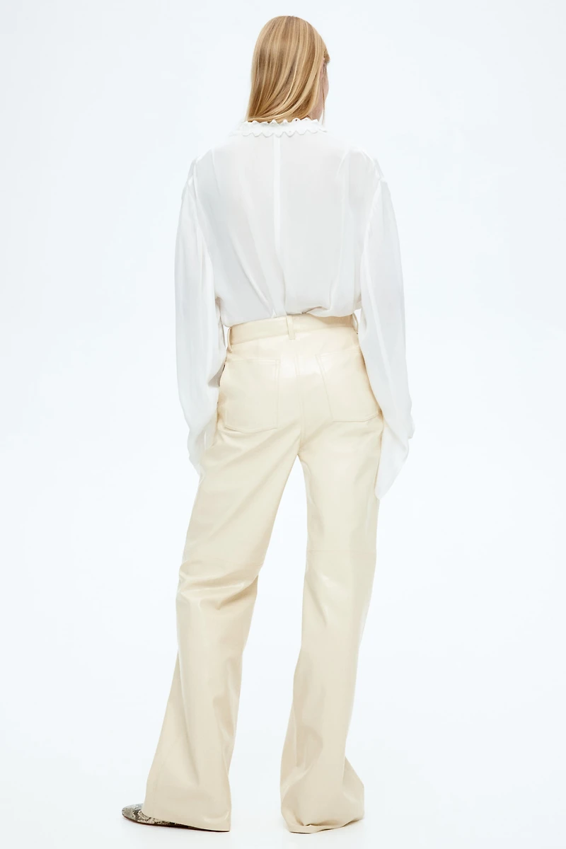 Pantalon en tissu enduit
