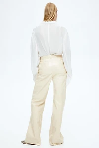 Pantalon en tissu enduit