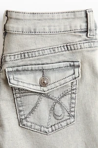 Jean taille basse jambes évasées