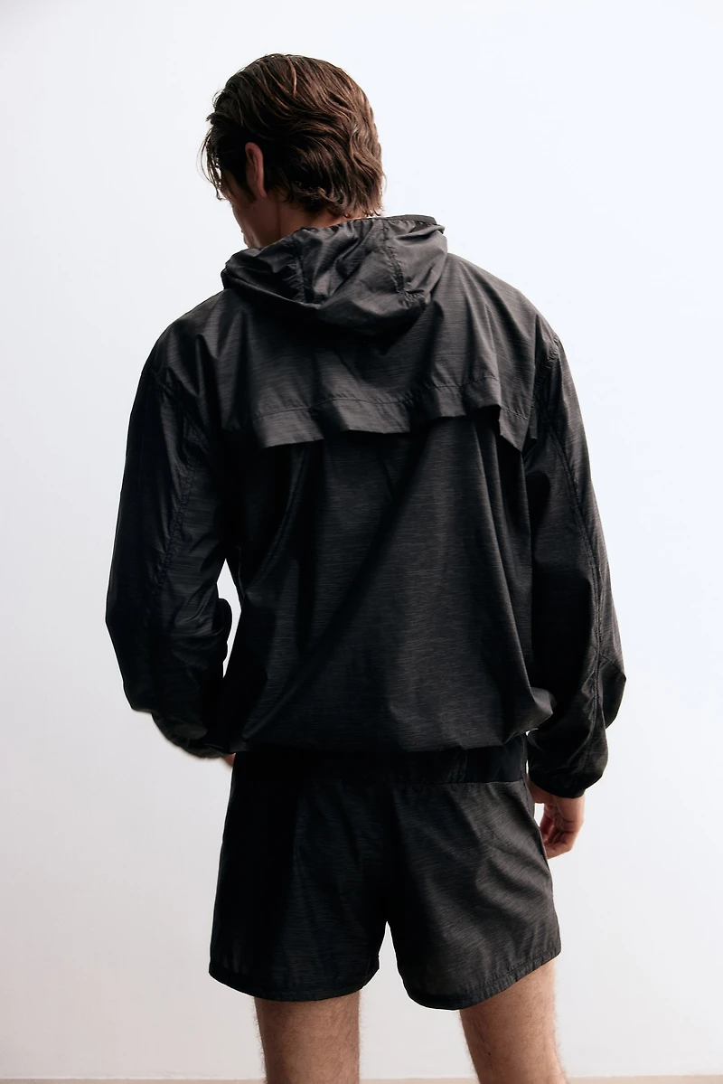 Veste de course hydrofuge ample