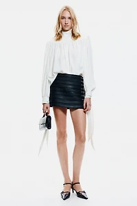 Blouse à épaulettes