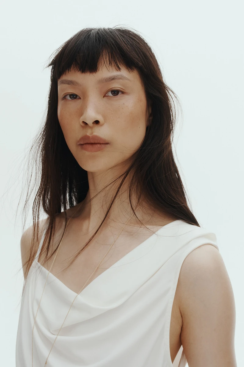 Draped Asymmetric Top