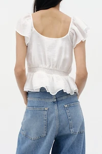 Blouse à manches volantées avec basque