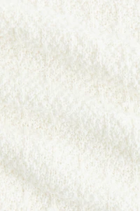 Haut péplum en tricot pointelle