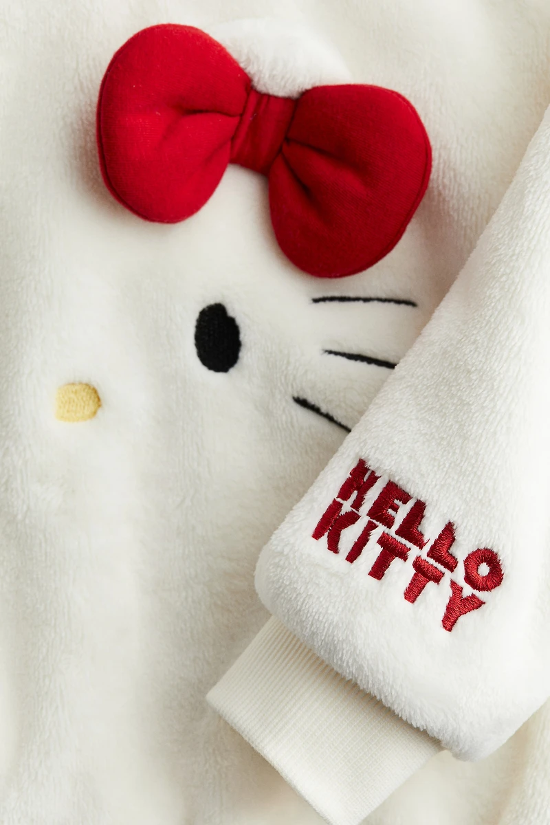 Chandail en tissu peluche avec motifs