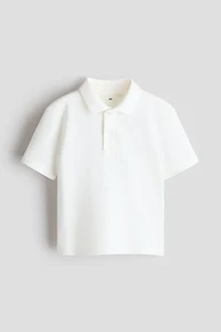 Polo en piqué avec motif brodé
