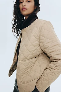 Veste matelassée avec col en velours côtelé