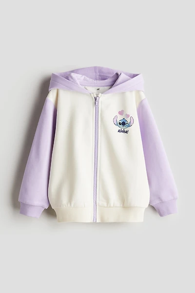Veste à capuchon imprimée et glissière
