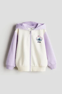 Veste à capuchon imprimée et glissière