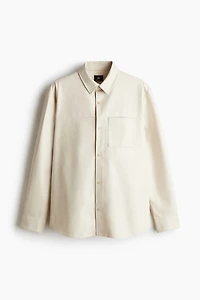 Chemise coupe classique en tissu enduit