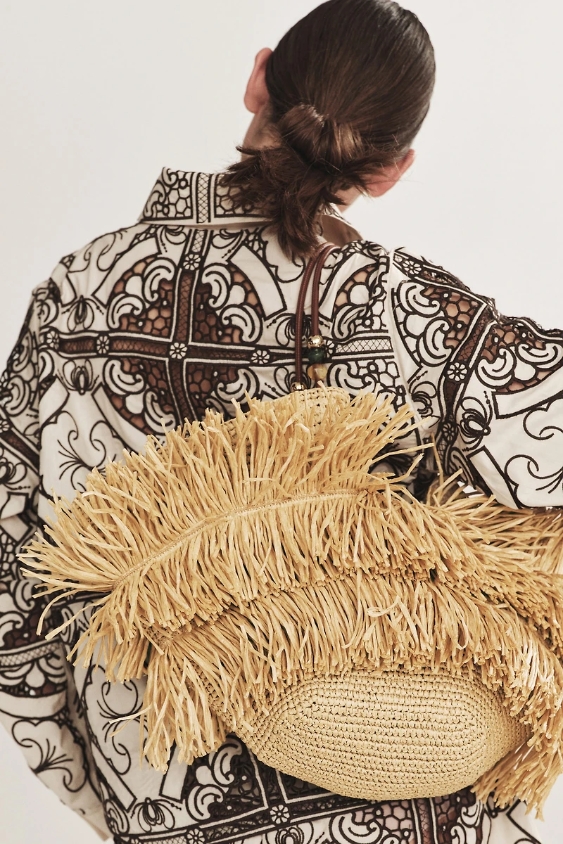 Sac de magasinage frangé en paille
