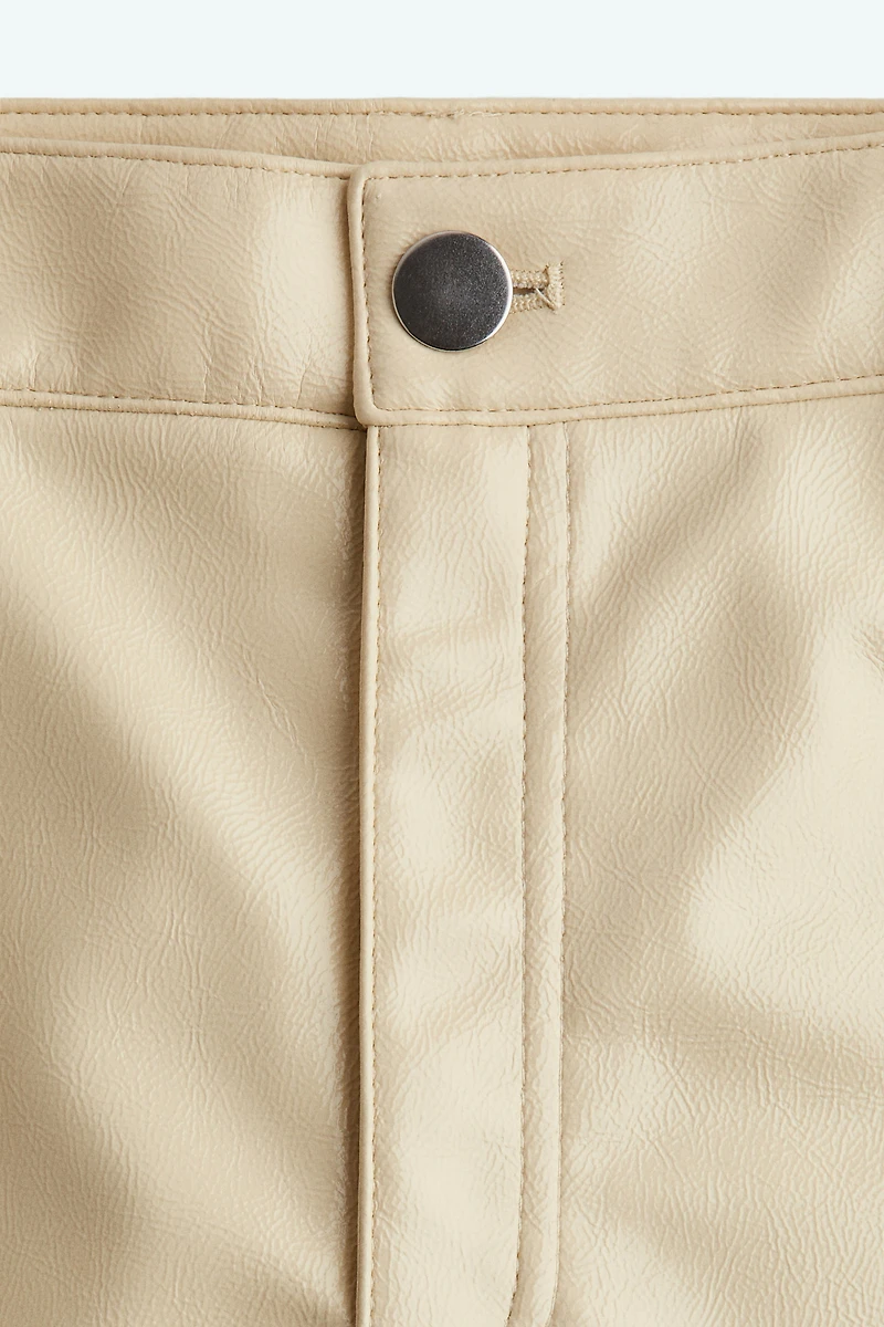 Pantalon en tissu enduit
