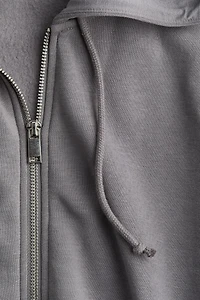 Veste courte avec capuchon et glissière