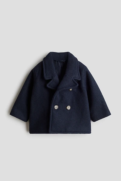 Manteau à fermeture croisée