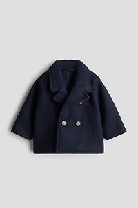 Manteau à fermeture croisée