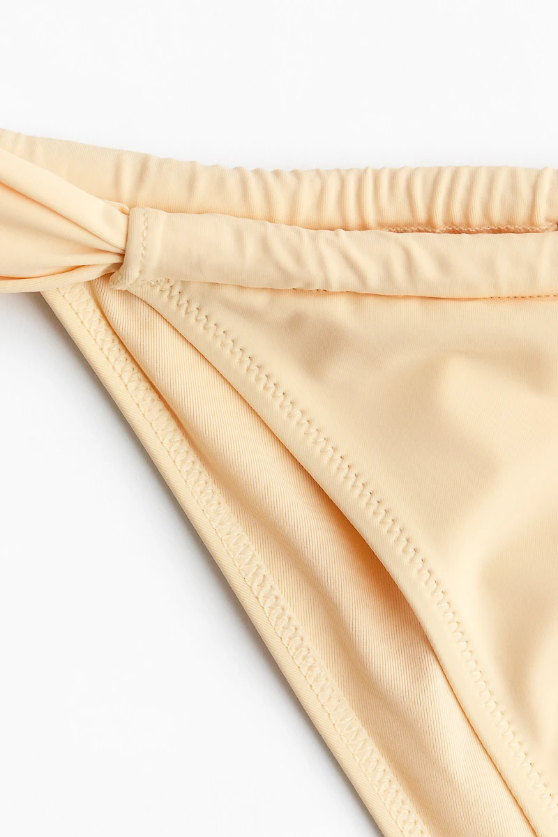Bas de maillot Tanga échancré
