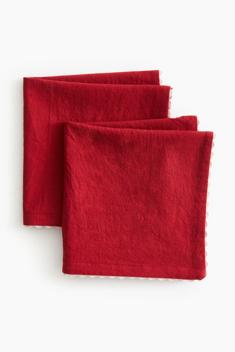 Lot de 2 serviettes table à bords festonnés