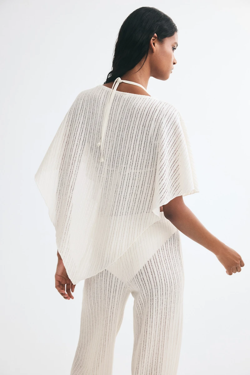Cape en tricot côtelé