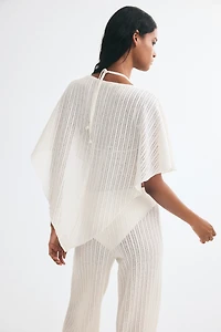 Cape en tricot côtelé