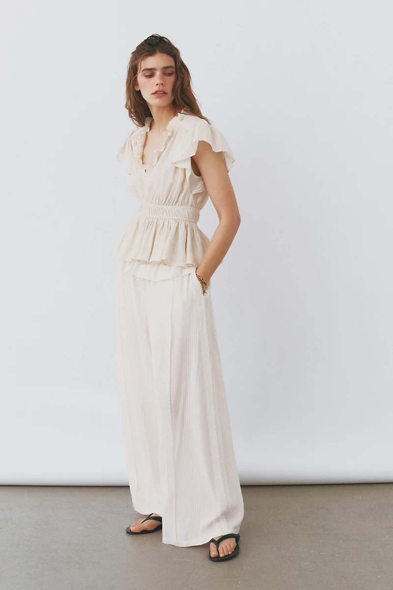 Flutter-Sleeved Peplum Blouse