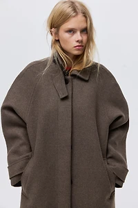 Manteau avec ceinture à nouer