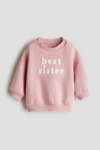 Chandail avec appliqués en tissu éponge