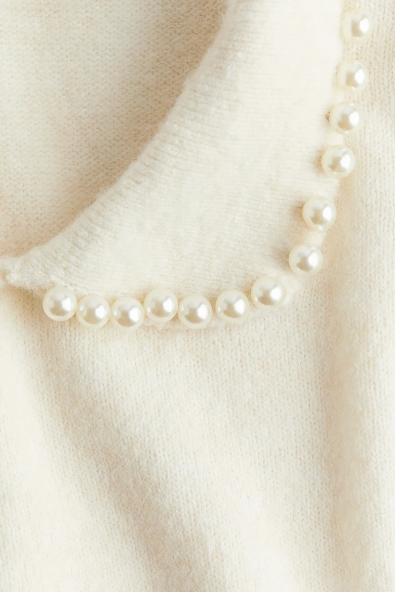 Haut en tricot avec col orné de perles fantaisie