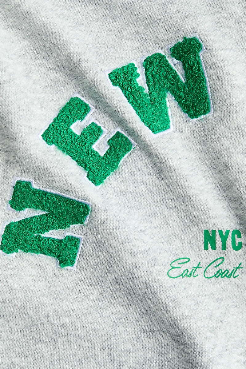 Veste à capuche fermeture éclair avec motifs