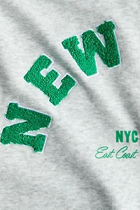 Veste à capuche fermeture éclair avec motifs