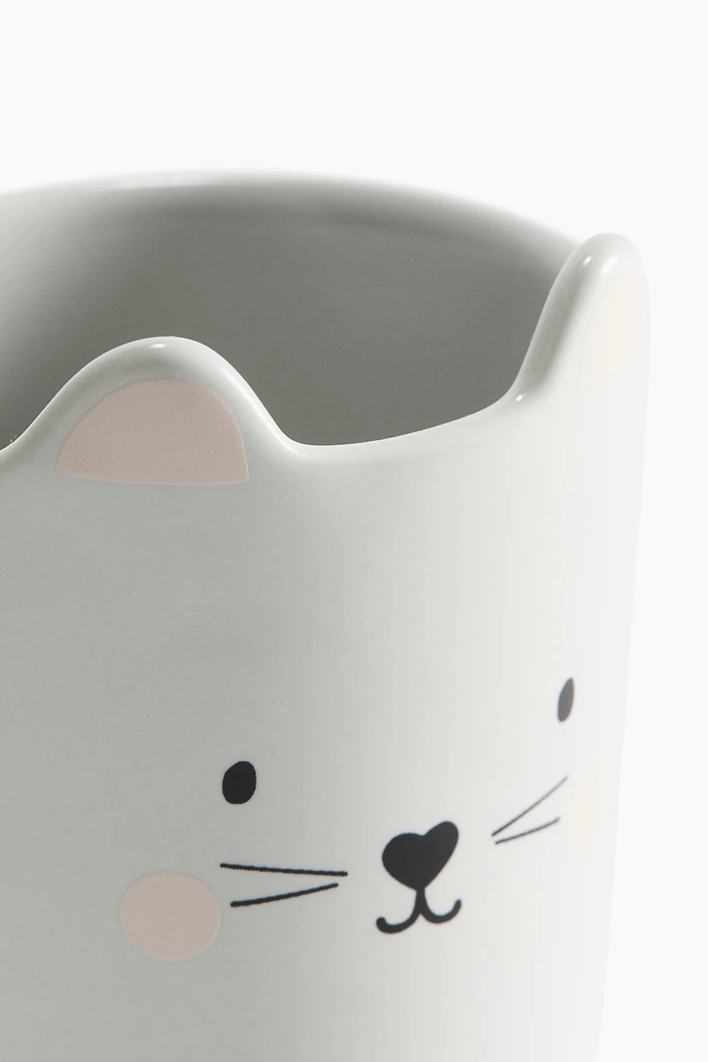 Tasse en porcelaine avec motif